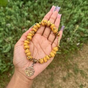 Ghana krobo trade bead yellow anklet with gold adinkra symbol charm